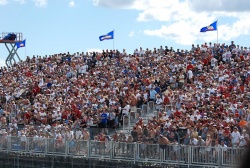 The grand stand on pit row was full